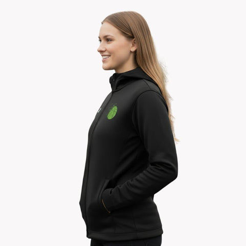 Sideview of a woman wearing a C2C black stock glide jacket.